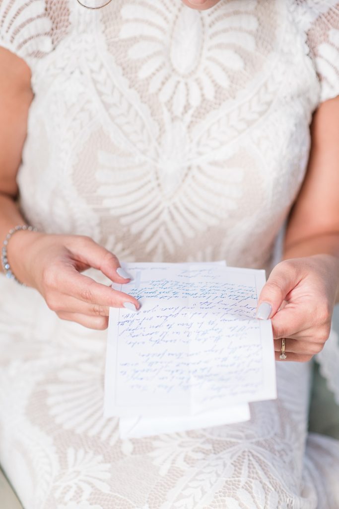 Bride reading letter before wedding by Richmond wedding photographer Kailey Brianne Photography 