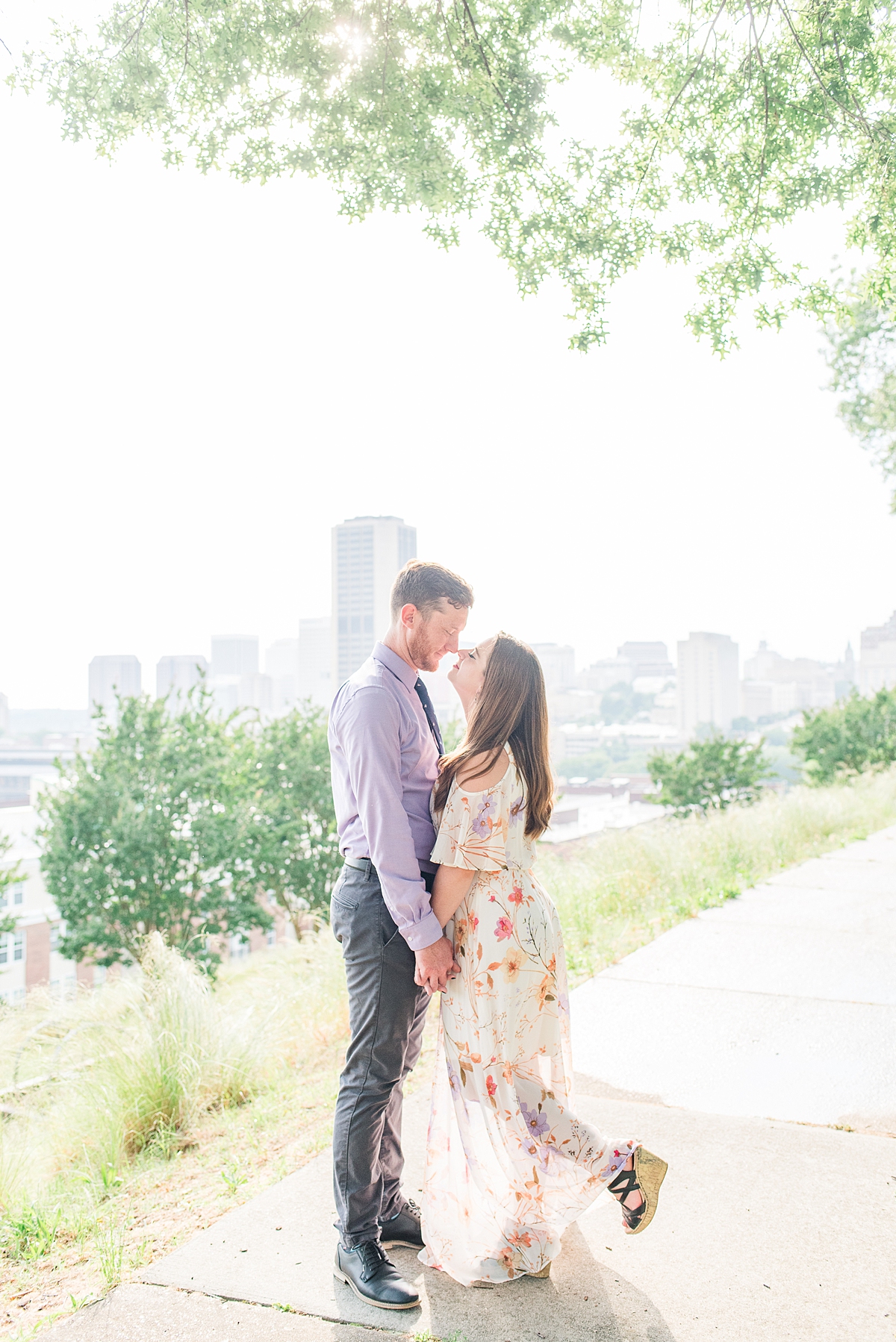 City Skyline View During Jefferson Park Engagement Session in Downtown Richmond. Photography by Richmond Wedding Photographer Kailey Brianne Photography. 