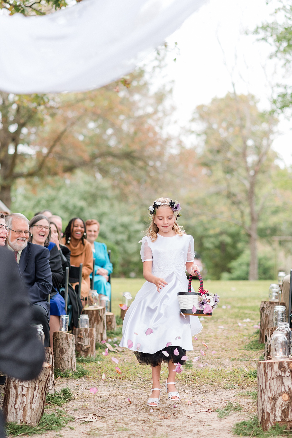 Flower Girl during Ceremony at a Fall Lake Gaston Wedding. Wedding Photography by Virginia Wedding Photographer Kailey Brianne Photography. 
