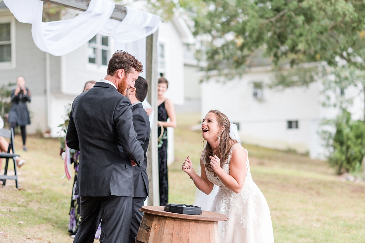 Die Roll at Alternative Ceremony at Lake Gaston Fall Wedding. Wedding Photography by Richmond Wedding Photographer Kailey Brianne Photography. 
