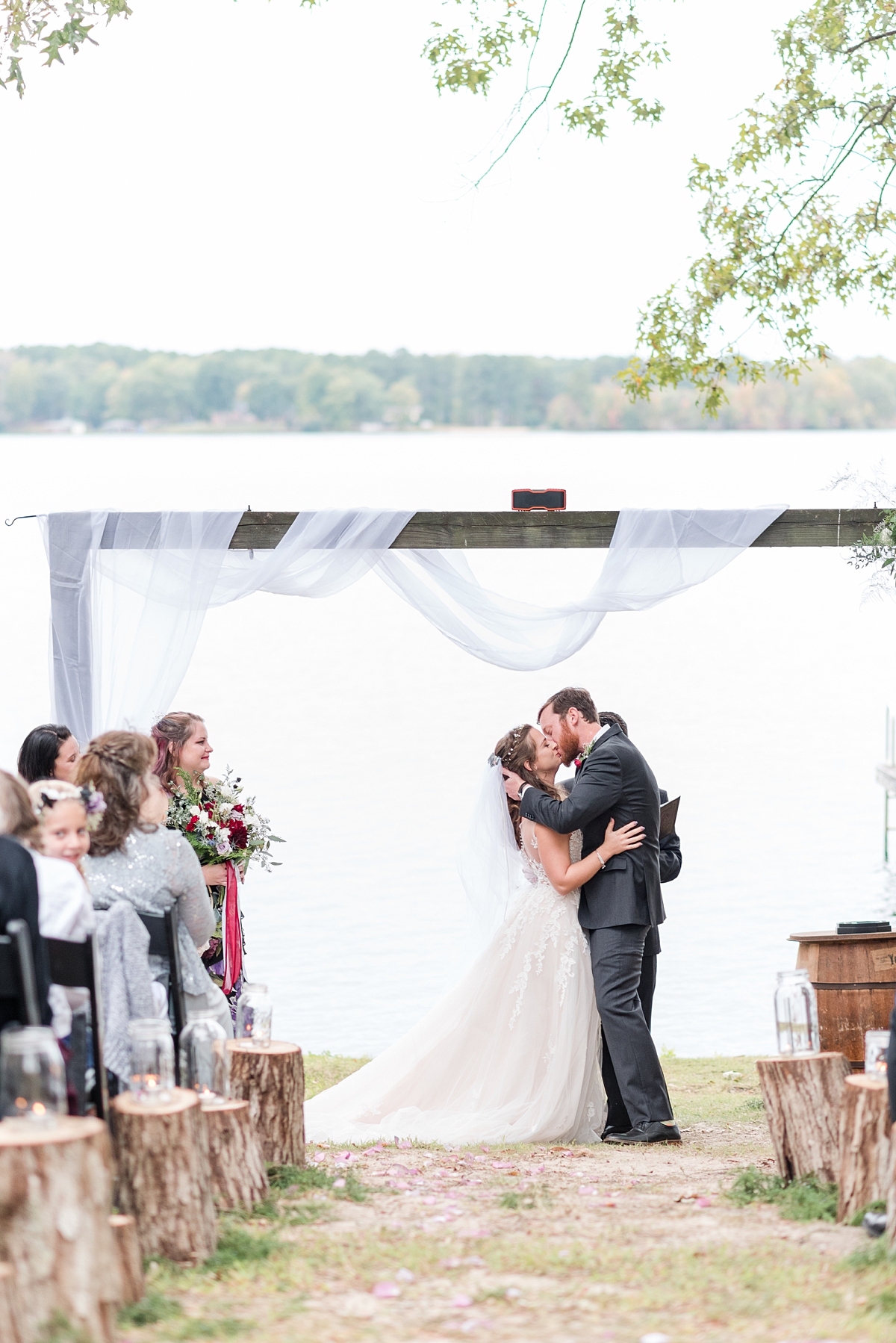 Kiss at Alternative Ceremony at Lake Gaston Fall Wedding. Wedding Photography by Richmond Wedding Photographer Kailey Brianne Photography. 