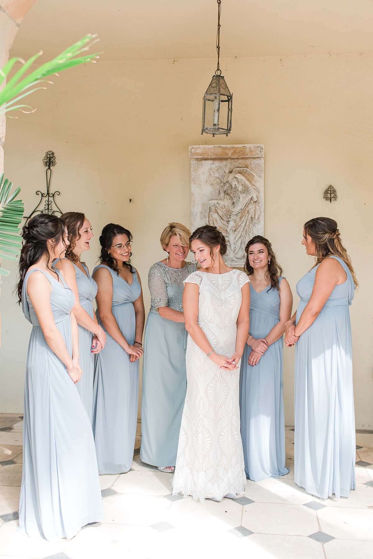 Bride putting on her Dress with Bridesmaid and Mother of the Bride at Virginia House Fall Wedding. Wedding Photography by Richmond Wedding Photographer Kailey Brianne Photography. 