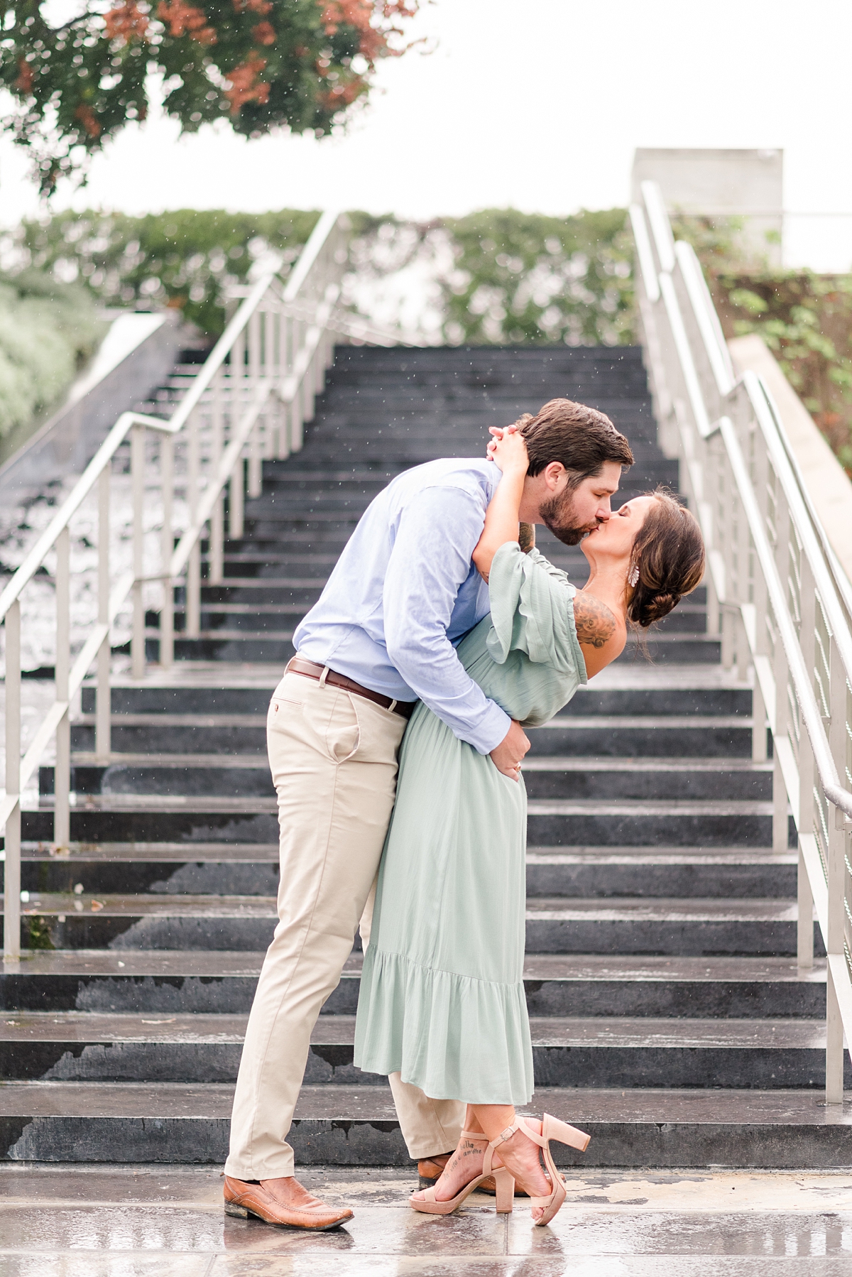 Dip Kiss by Fountain Steps at Virginia Museum of Fine Arts Rainy Summer Engagement Session. Engagement Photography by Richmond Wedding Photographer Kailey Brianne Photography. 