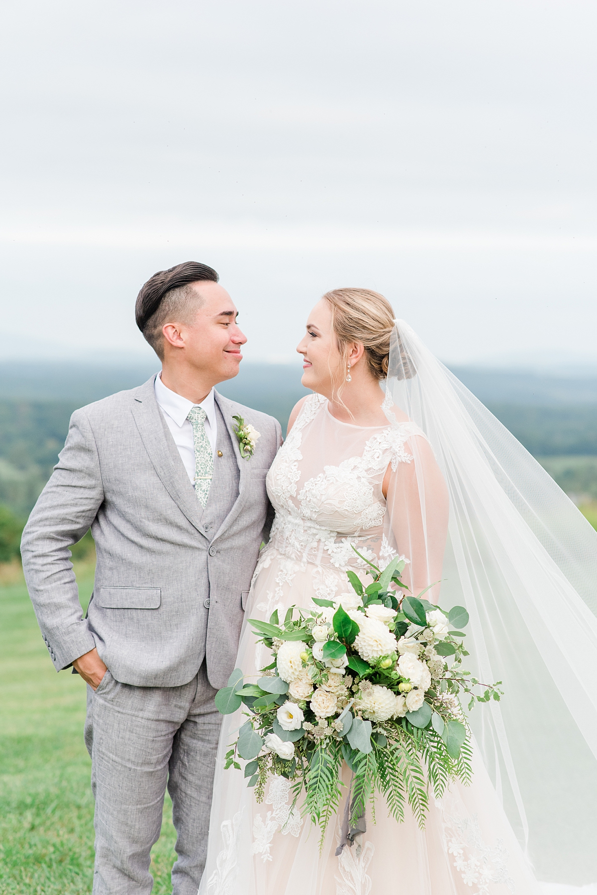 Bride and Groom Portraits with Veil and Mountain View at a Timeless Grace Estate Winery Wedding. Wedding Photography by Charlottesville Wedding Photographer Kailey Brianne Photography.