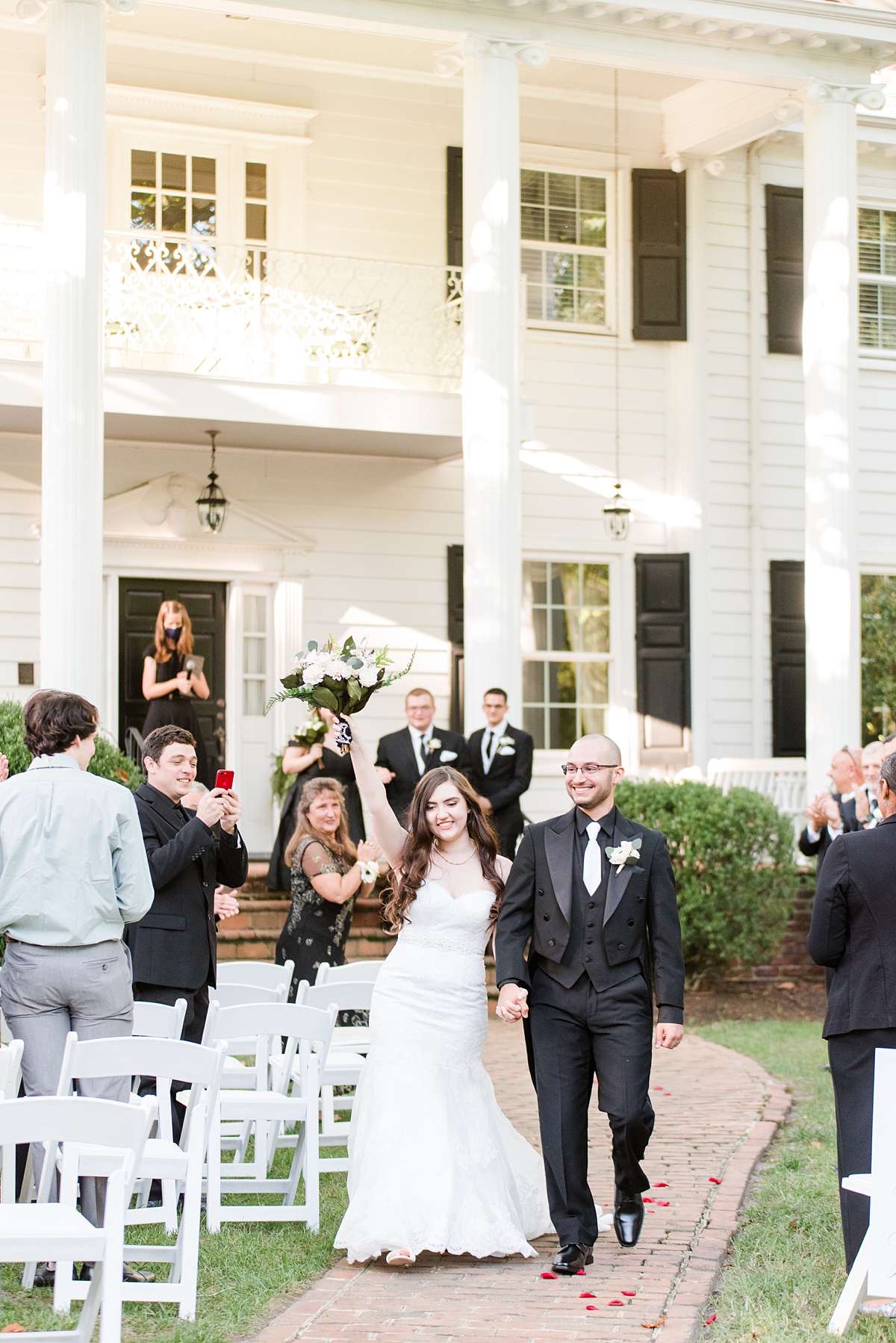 Bride and Groom Ceremony Exit from Virginia Cliffe Inn Summer Wedding. Wedding Photography by Richmond Wedding Photographer Kailey Brianne Photography. 