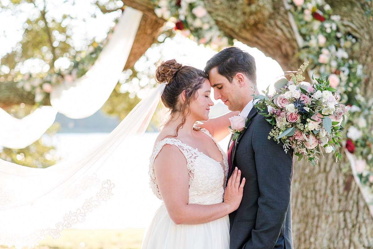 Bride and Groom Portraits with Veil at Lake Front Fall Wedding. Wedding Photography by Yorktown Wedding Photographer Kailey Brianne Photography. 