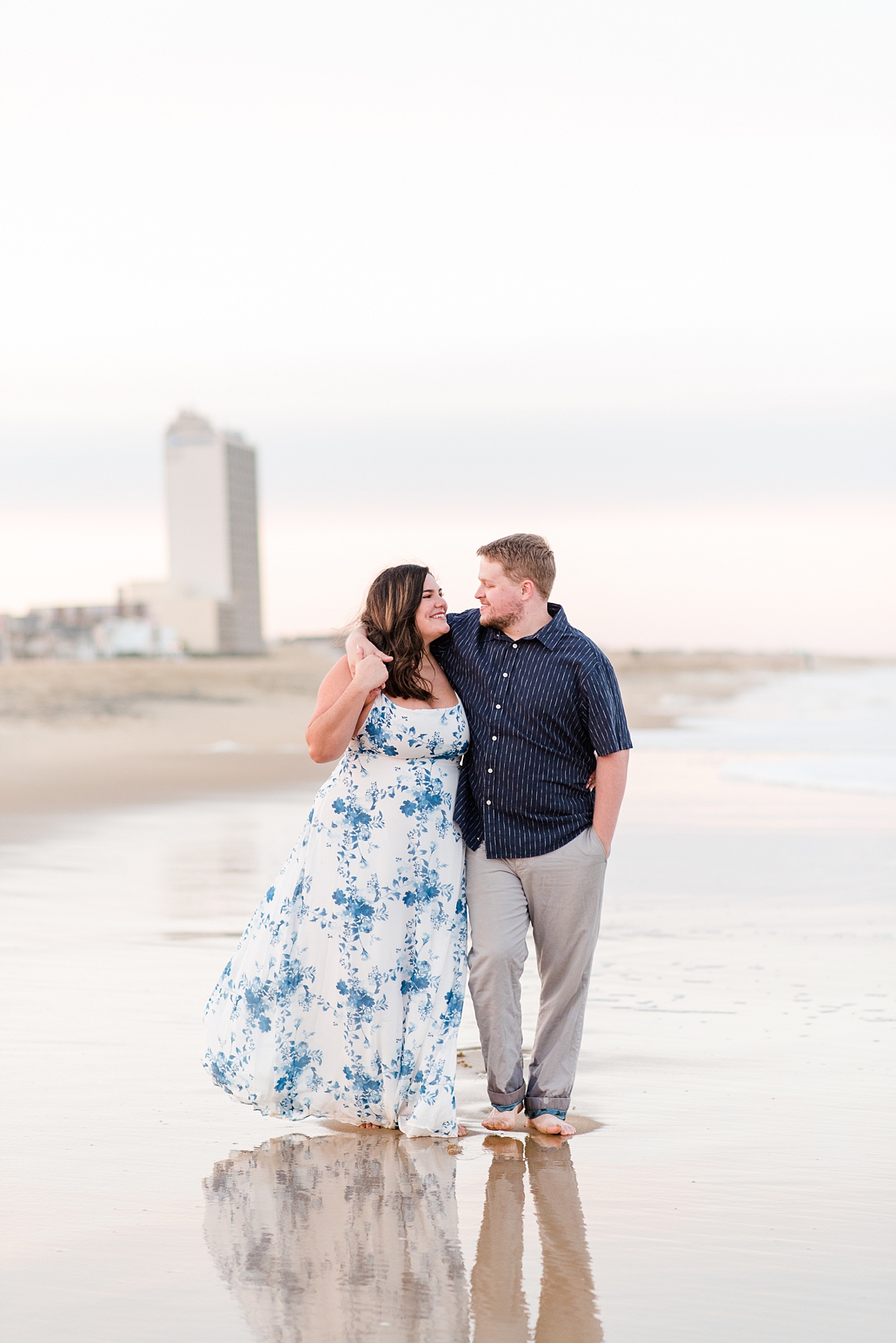 Couple Walking in the Water at Virginia Beach Engagement Session. Engagement Photography by Yorktown Wedding Photographer Kailey Brianne Photography. 