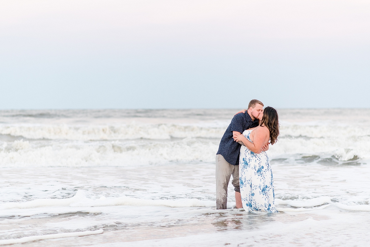 Couple Kissing in the Water at Virginia Beach Engagement Session. Engagement Photography by Yorktown Wedding Photographer Kailey Brianne Photography. 