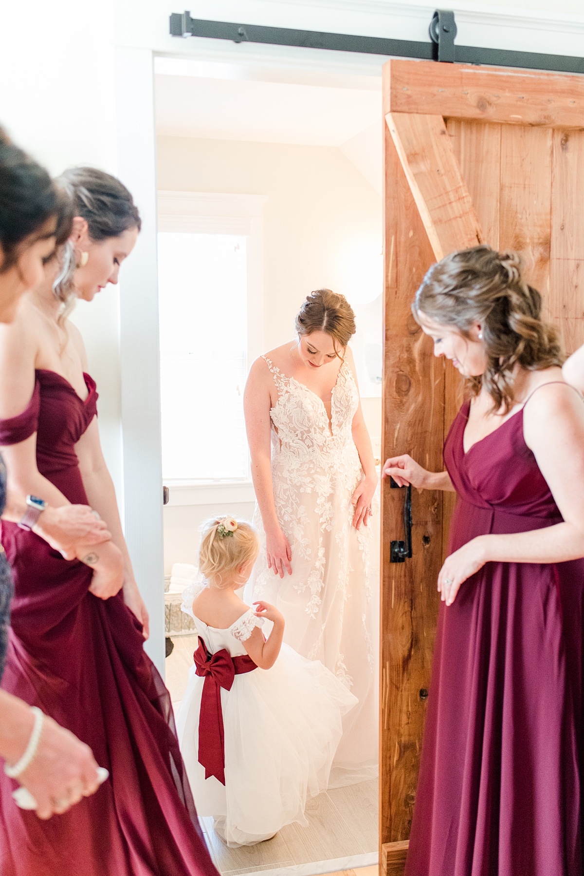 Bridesmaids Reacting to Bride Getting in the Dress at Burlington Fall Wedding. Wedding Photography by Richmond Wedding Photographer Kailey Brianne Photography. 