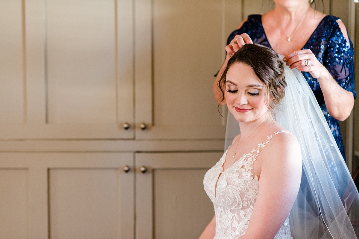 Mother putting on the Bride's Veil Before Ceremony at Burlington Plantation Fall Wedding. Wedding Photography by Richmond Wedding Photographer Kailey Brianne Photography. 