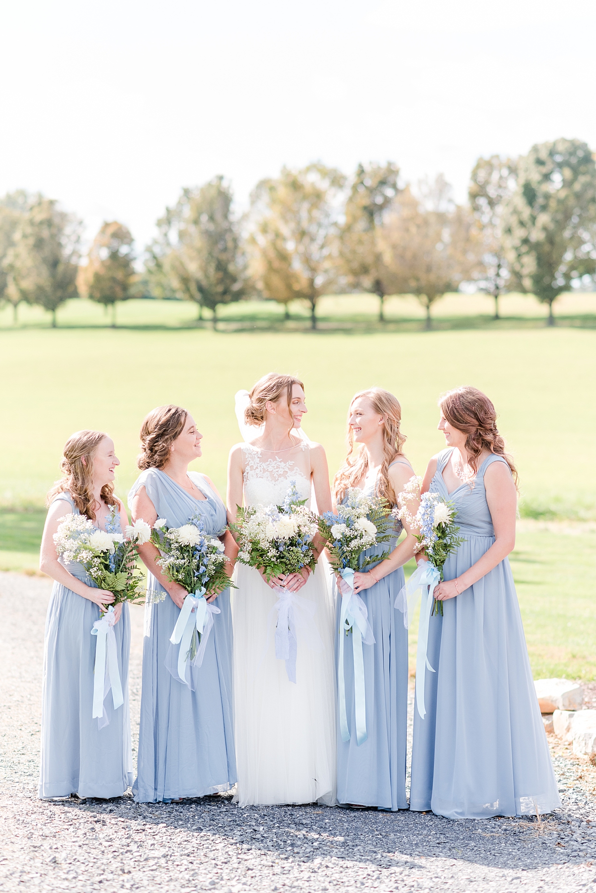 Bridal Party Portraits with Blue Bridesmaid Dresses at Granary at Valley Pike Rustic Wedding. Wedding Photography by Richmond Wedding Photographer Kailey Brianne Photography. 