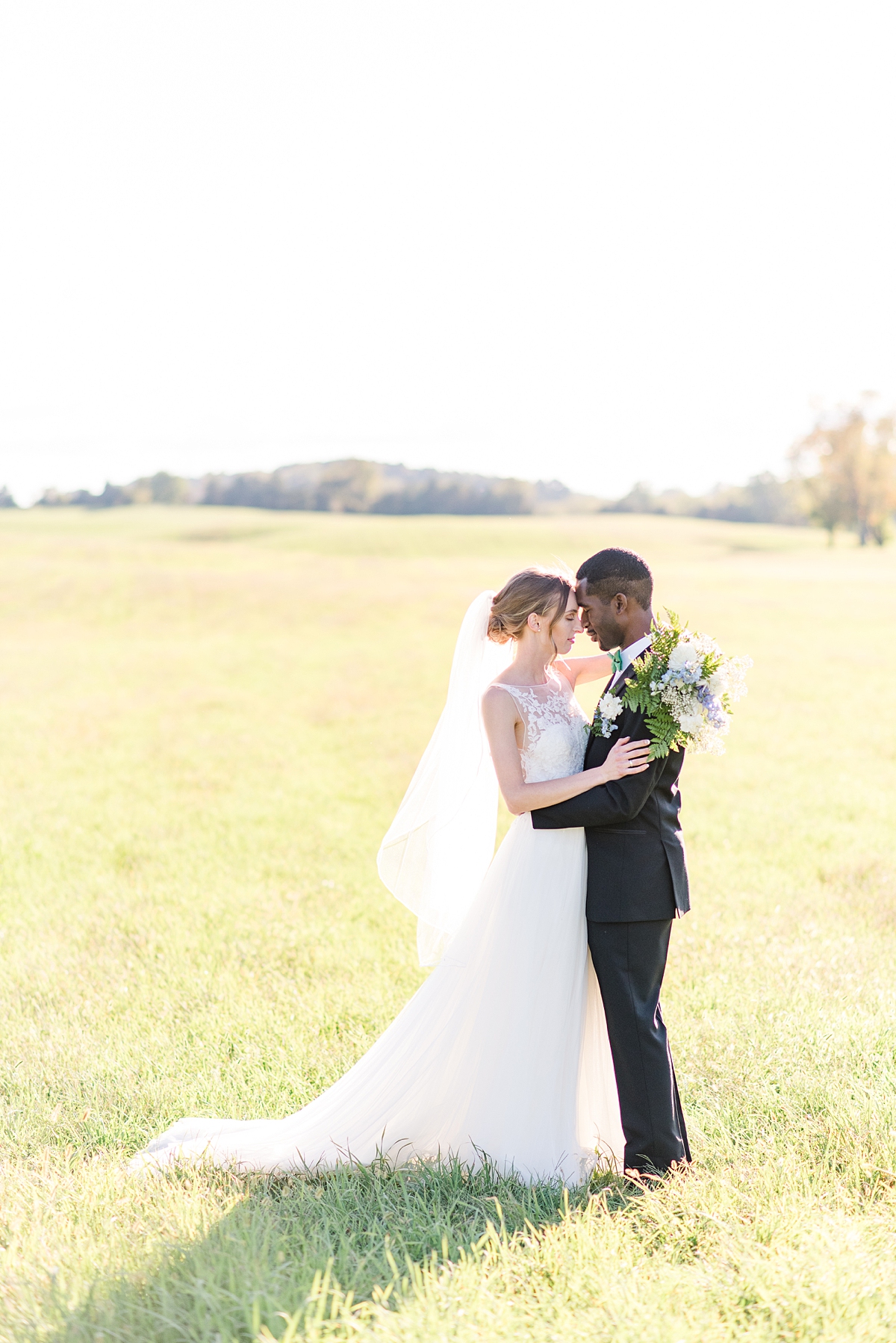 Bride and Groom Portraits with Veil at  Granary at Valley Pike Rustic Wedding. Wedding Photography by Charlottesville Wedding Photographer Kailey Brianne Photography. 
