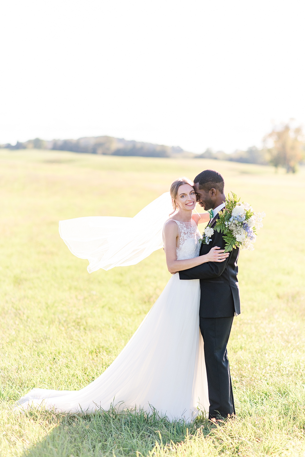 Bride and Groom Portraits with Veil at  Granary at Valley Pike Rustic Wedding. Wedding Photography by Charlottesville Wedding Photographer Kailey Brianne Photography. 