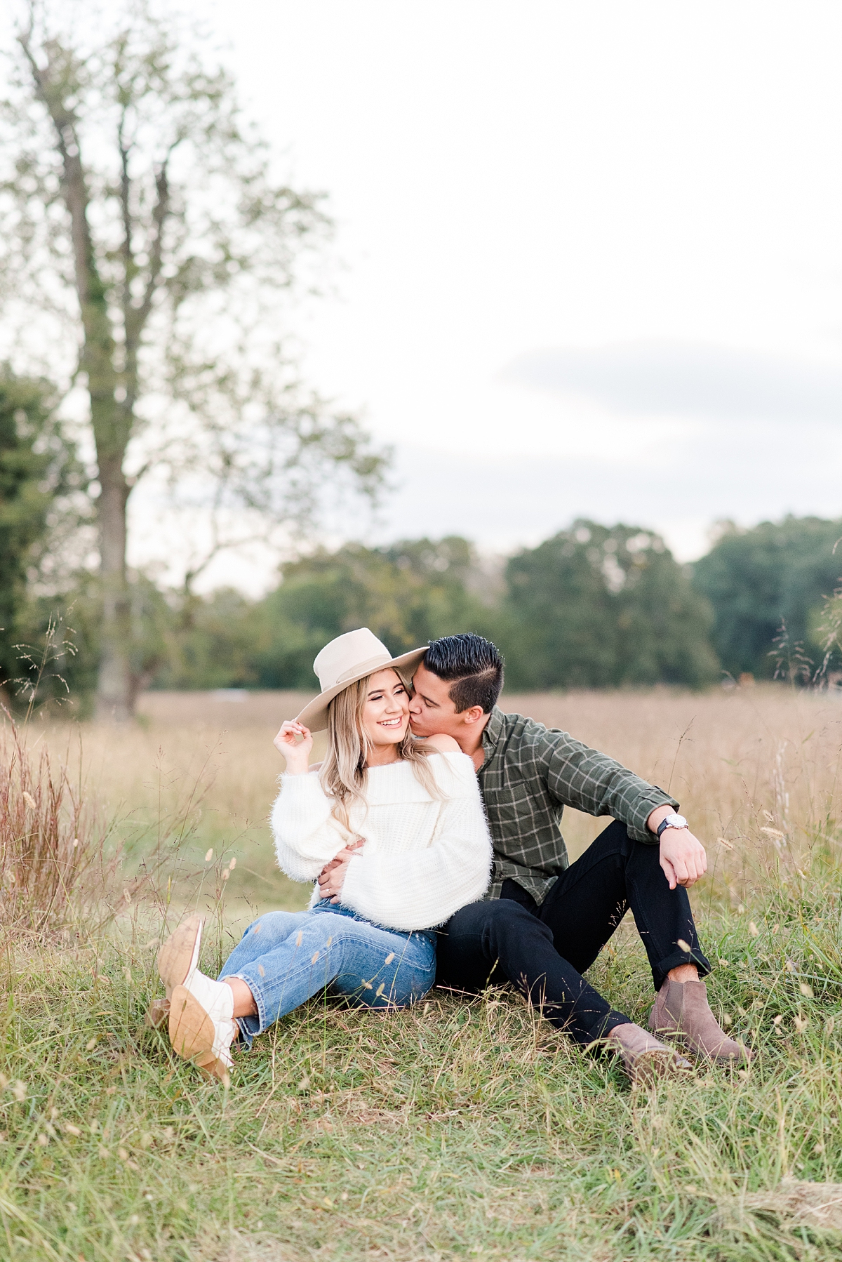 Stylish Engagement Outfit with Hat at Yorktown Battlefield Fall Engagement Session. Engagement Photography by Yorktown Wedding Photographer Kailey Brianne Photography. 