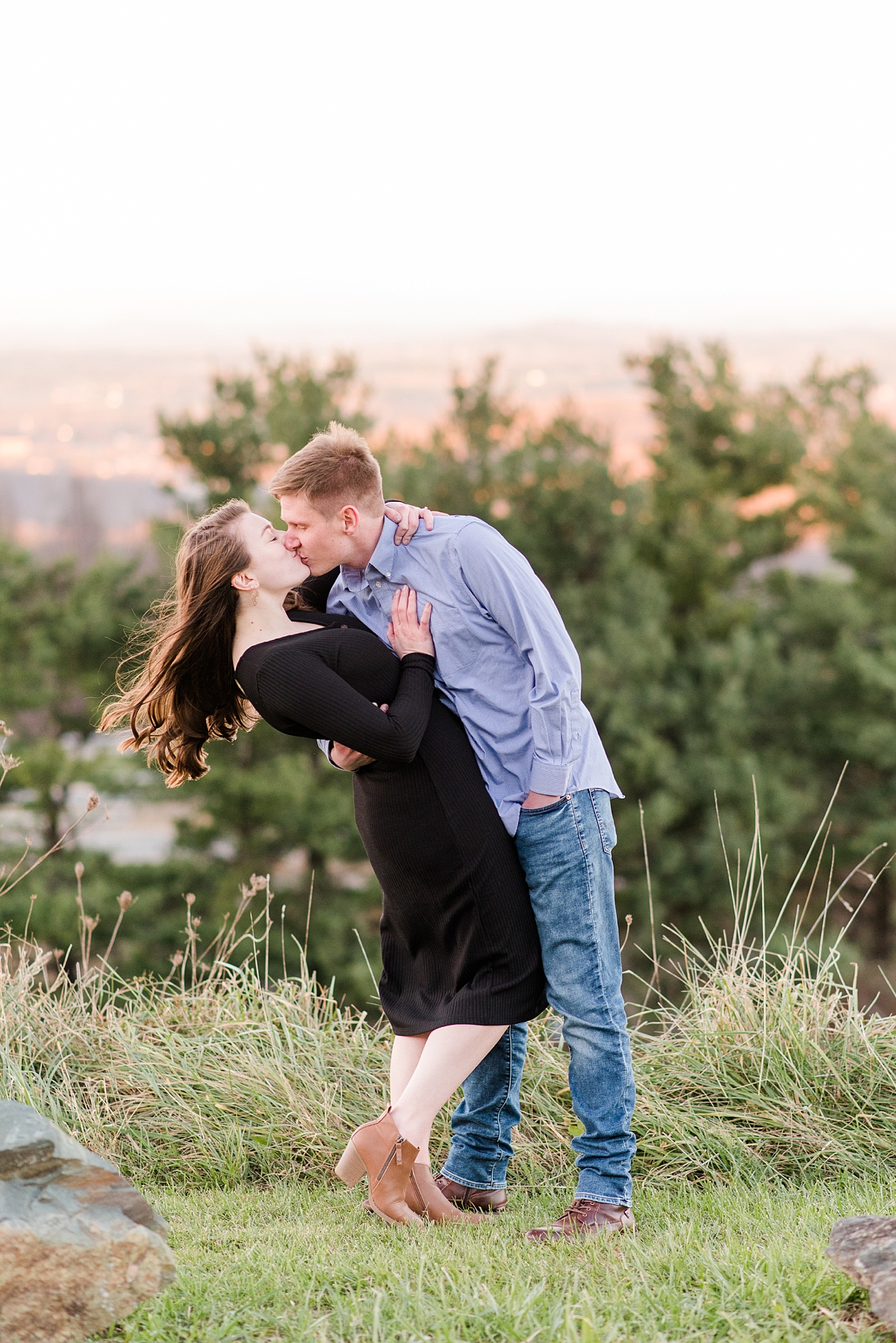 Kiss with Mountain View at Fall Rockfish Gap Overlook Engagement Session. Photography by Richmond Wedding Photographer Kailey Brianne Photography.