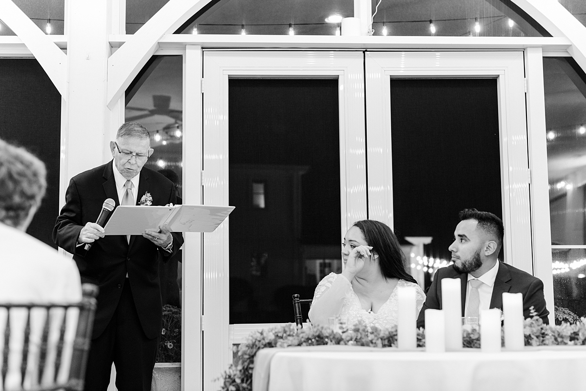 Bride and Groom During Toasts at Virginia Cliffe Inn Wedding Reception. Wedding Photography by Richmond Wedding Photographer Kailey Brianne Photography.