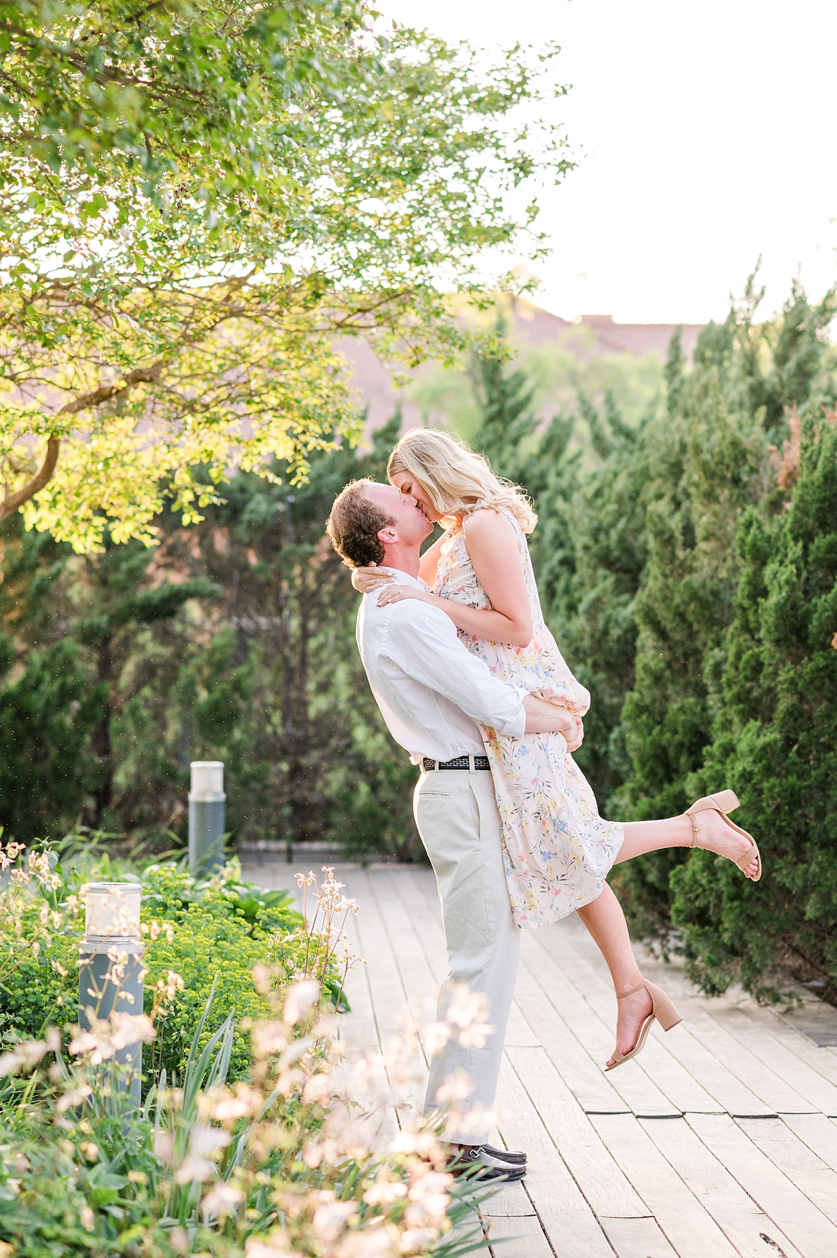 Stunning scissor kick kiss portrait during spring engagement session at the VMFA in downtown Richmond. Photography by Virginia wedding photographer Kailey Brianne Photography. 