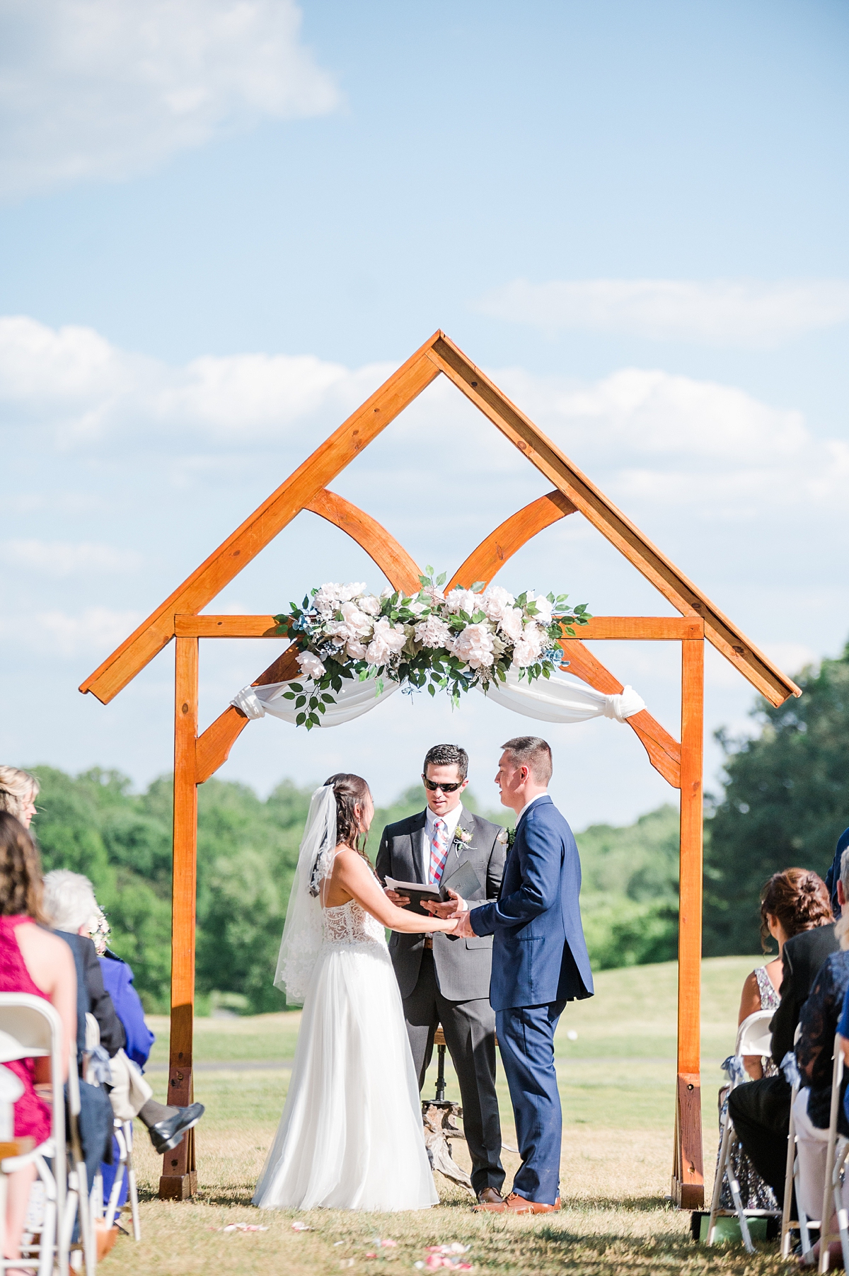 Wedding Ceremony with beautiful arch at spring Hanover wedding. Hanover Wedding Photographer Kailey Brianne Photography. 