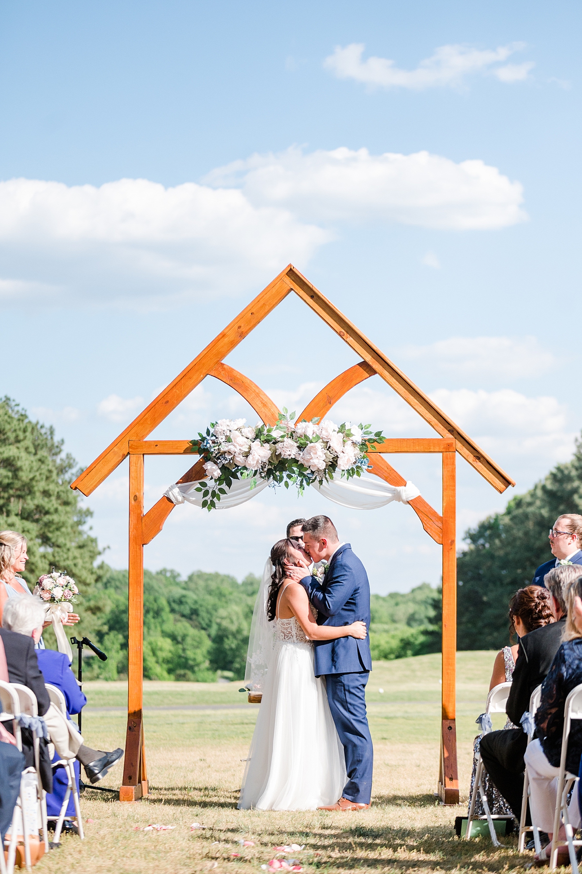 Epic Ceremony Kiss at  Hanover Golf Club spring wedding. Photography by Virginia Wedding Photographer Kailey Brianne Photography. 