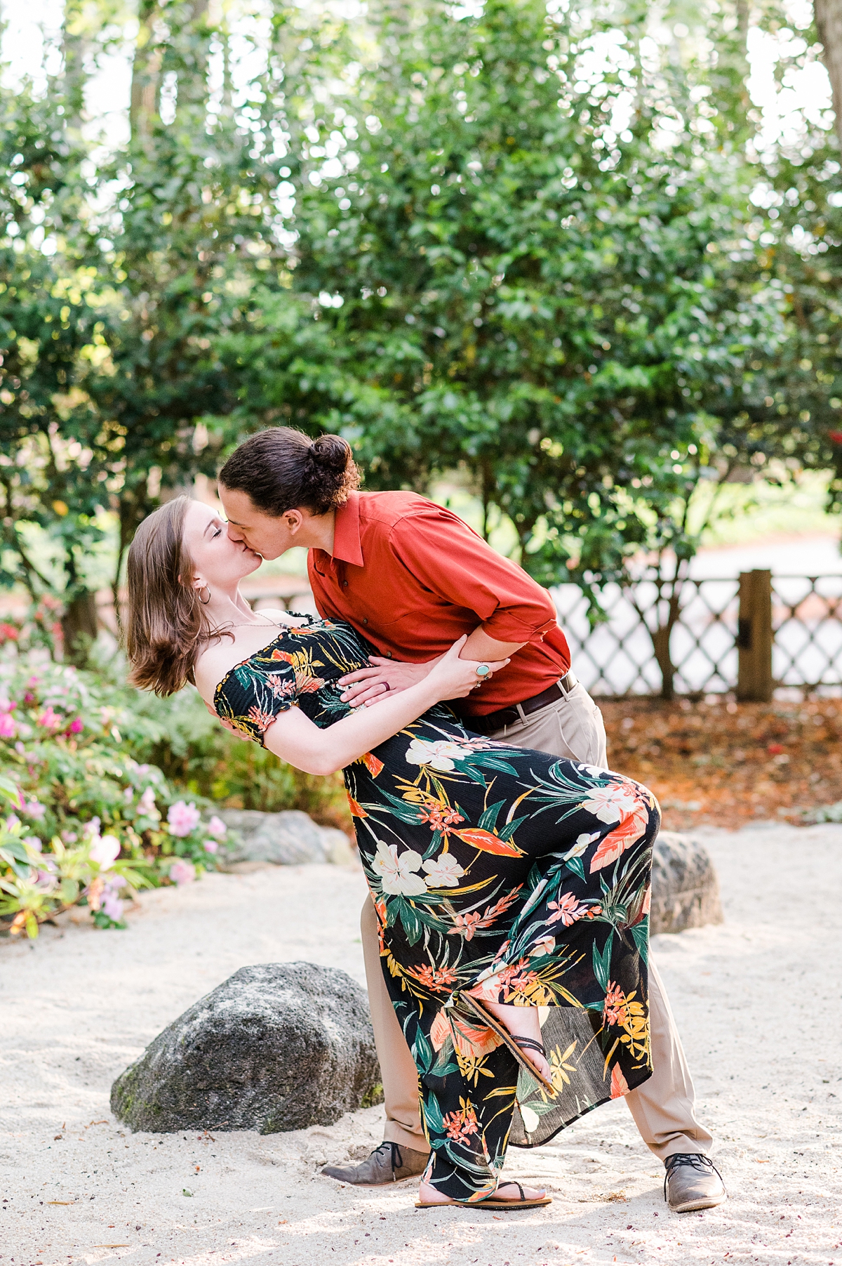 Dip Kiss during Spring Red Wing Park Engagement Session with blooms. Photography by Virginia Beach Wedding Photographer Kailey Brianne Photography. 