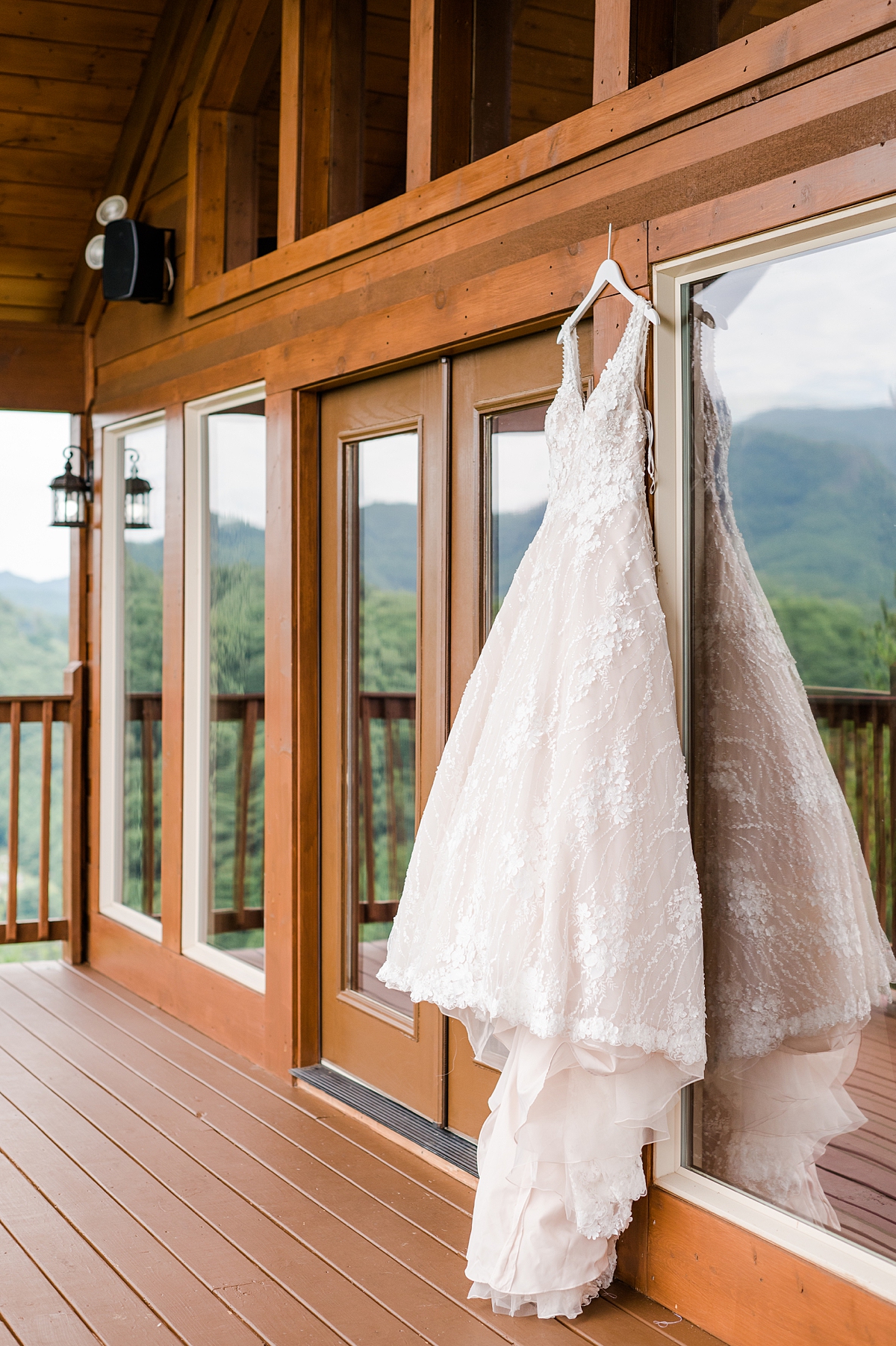 Wedding Dress Hanging with Mountain Views at a Magnolia Venue Summer Mountain Wedding in Tennessee. Wedding Photography by Virginia Wedding Photographer Kailey Brianne Photography. 