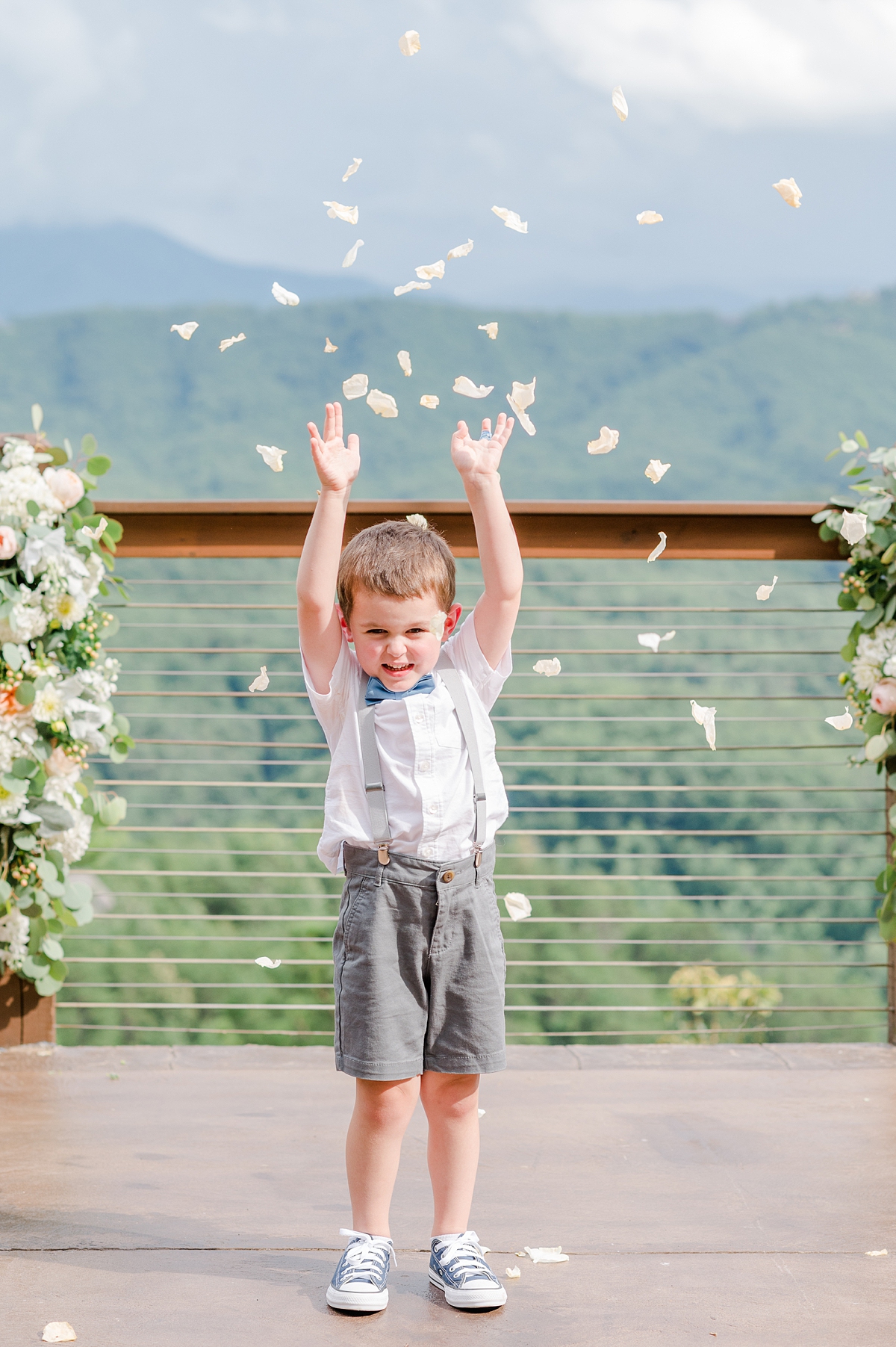 Flower Boy with Suspenders and Bow Tie at Summer Magnolia Venue Smoky Mountain Wedding. Virginia Wedding Photographer Kailey Brianne Photography. 