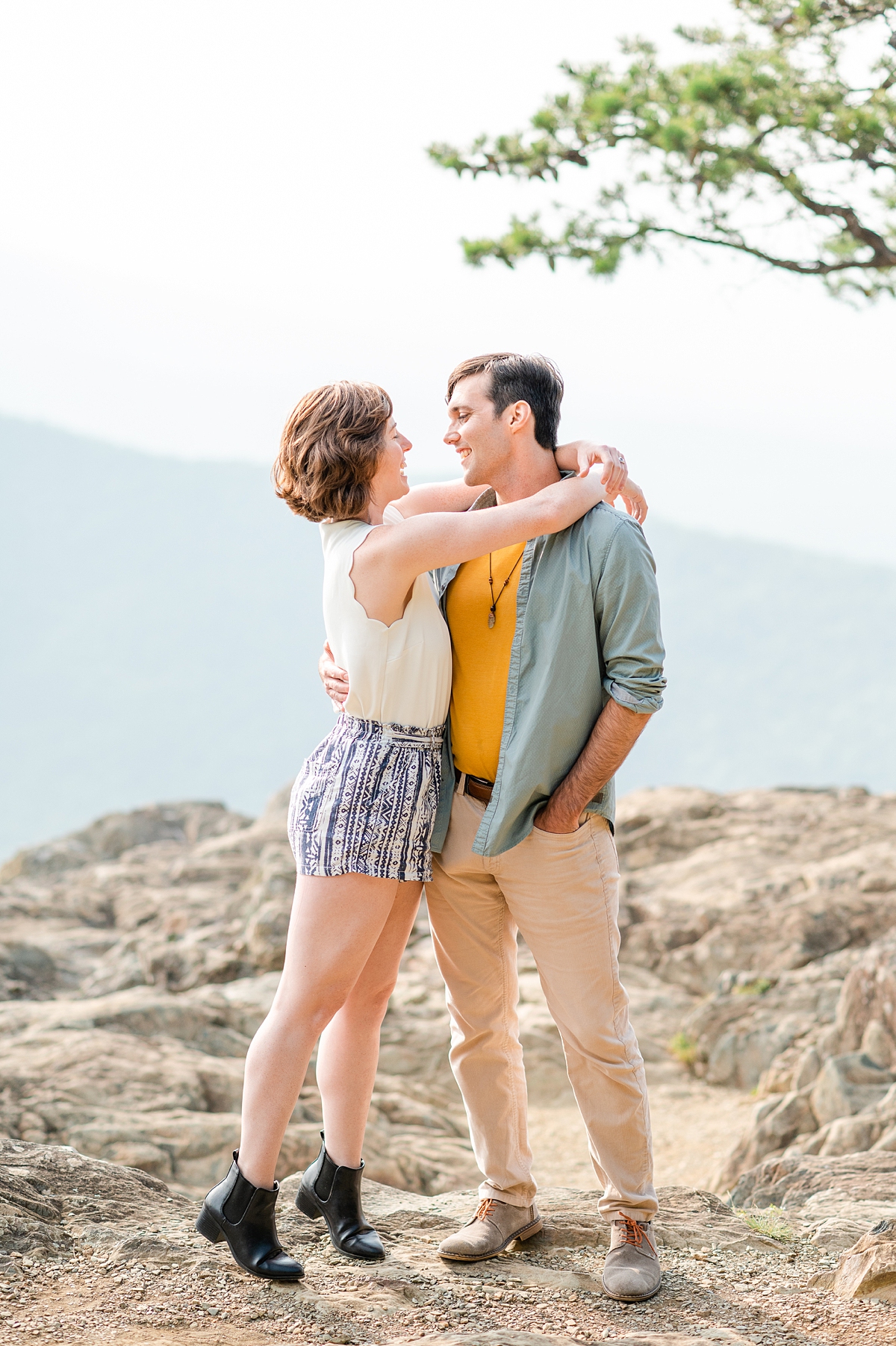 A Summer Raven's Roost Overlook Engagement Session with Mountain Views and Boho Style Outfits. Photography by Virginia Wedding Photographer Kailey Brianne Photography. 
