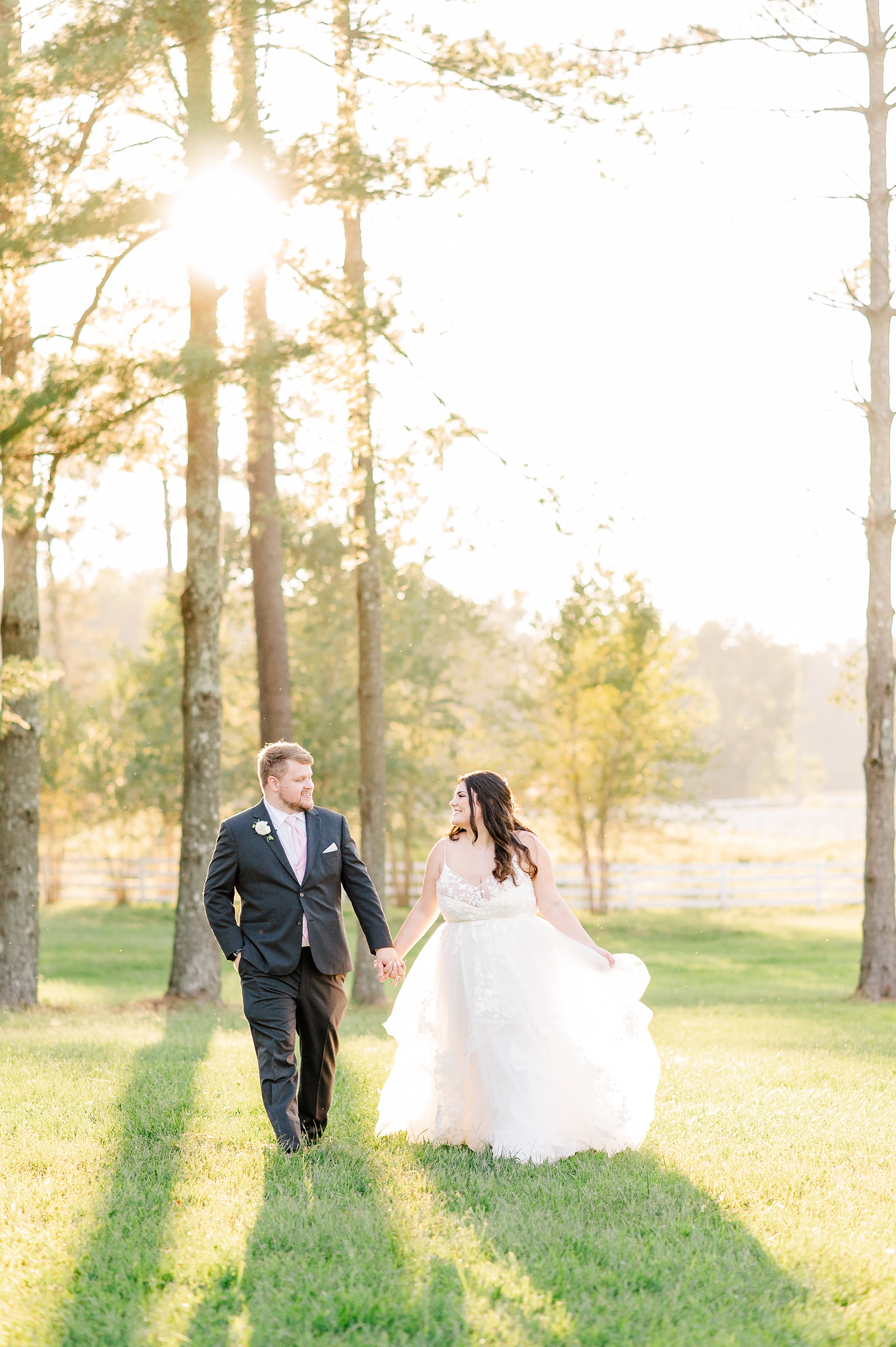 Bride and Groom Sunset Portraits Running through Field at a Cumberland Estate Wedding. Photography by Virginia Wedding Photographer Kailey Brianne Photography. 