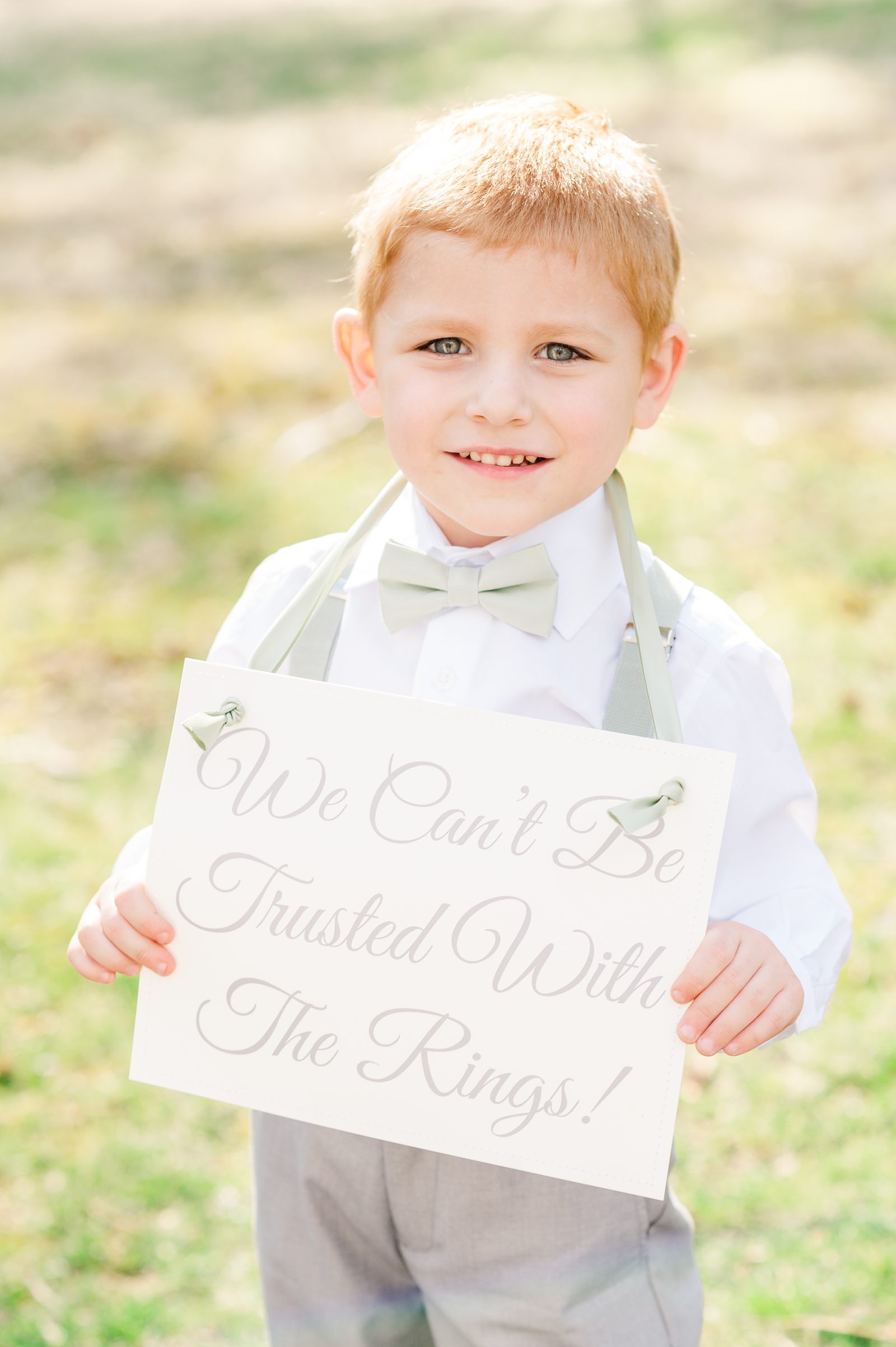 Ring Bearer with Sign during Spring Virginia Cliffe Inn Wedding. Richmond Wedding Photographer Kailey Brianne Photography. 