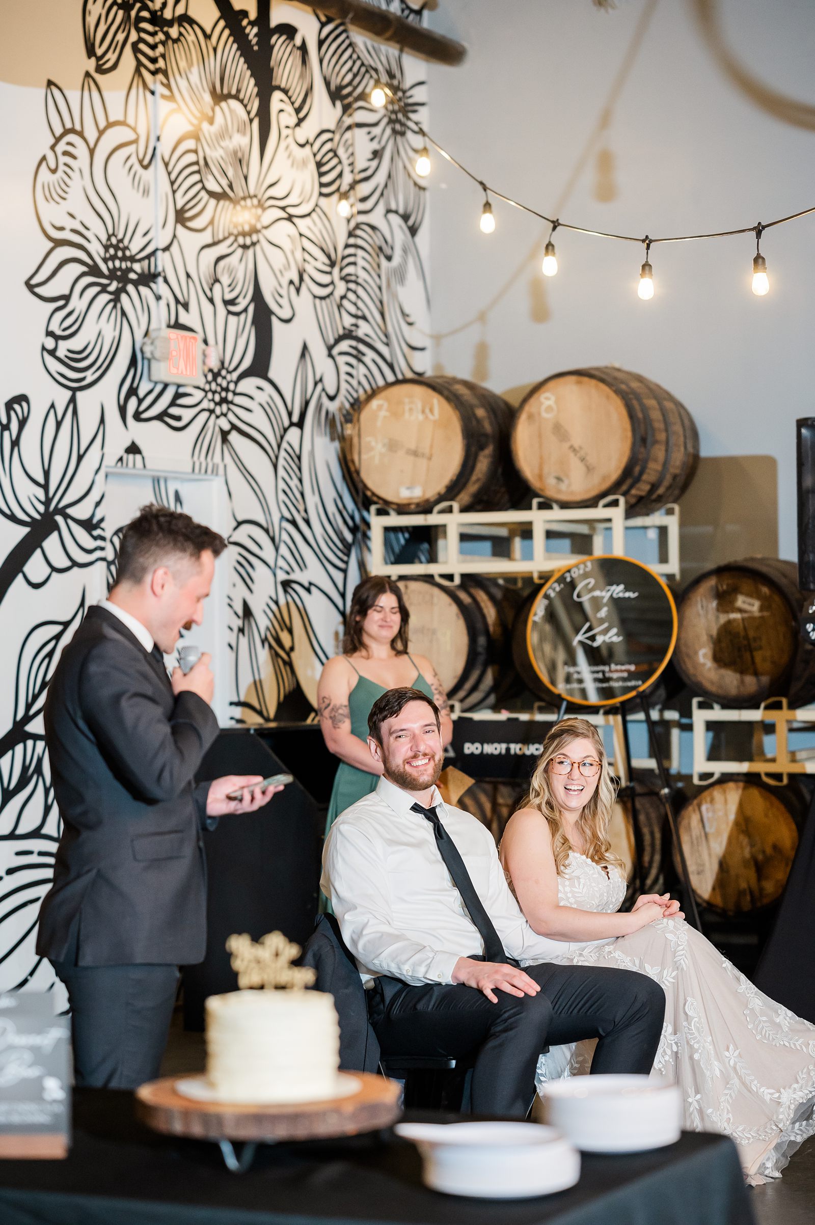 Bride and Groom Reactions During Toasts at Triple Crossing Beer Wedding Reception