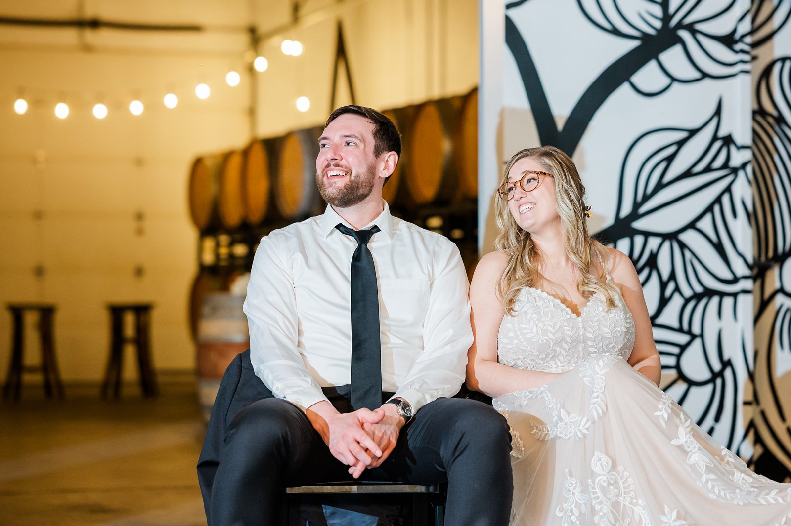 Bride and Groom Reactions During Toasts at Triple Crossing Beer Wedding Reception