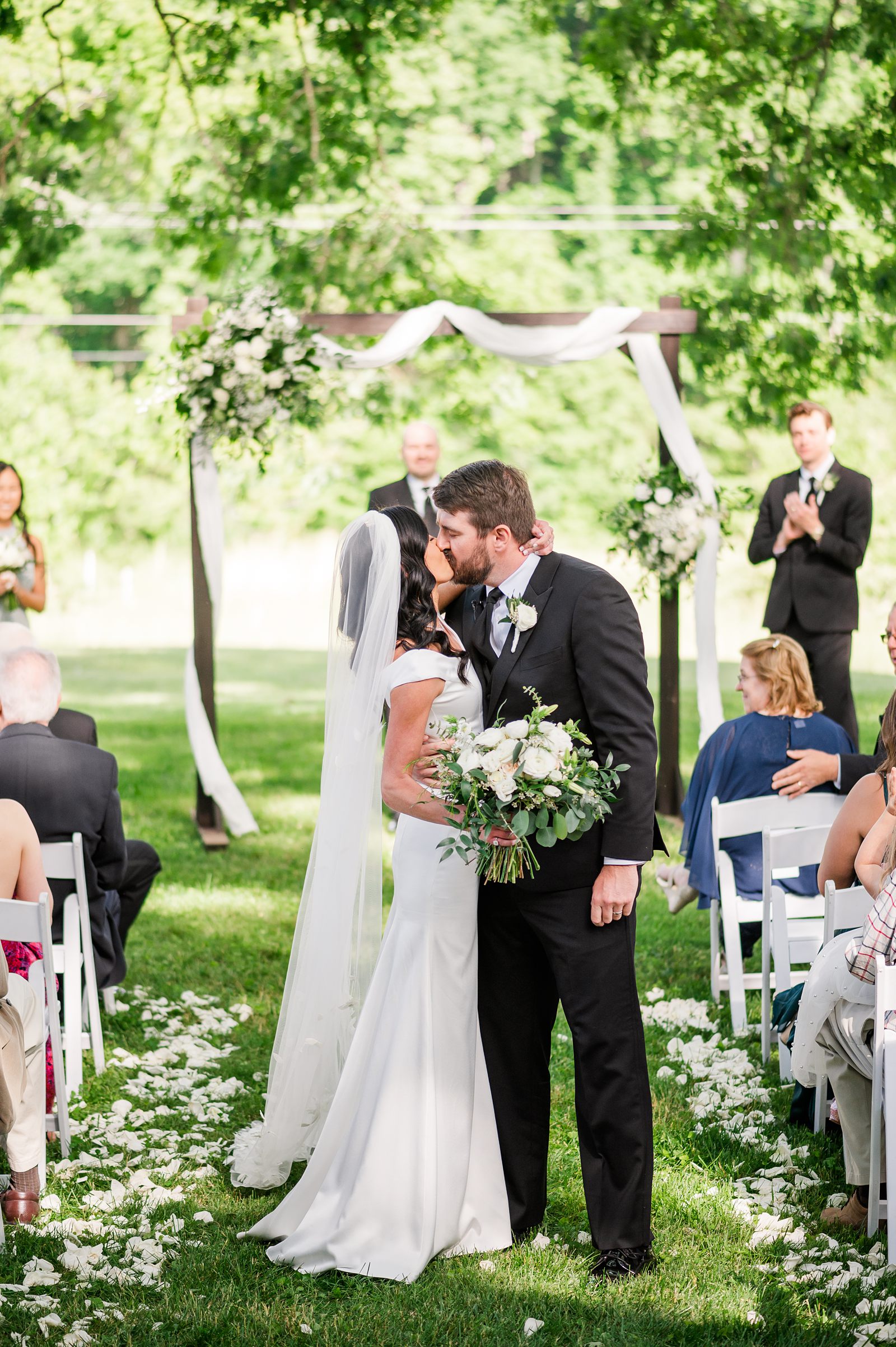 Exit Kiss during Spring Virginia Wedding ceremony in backyard 