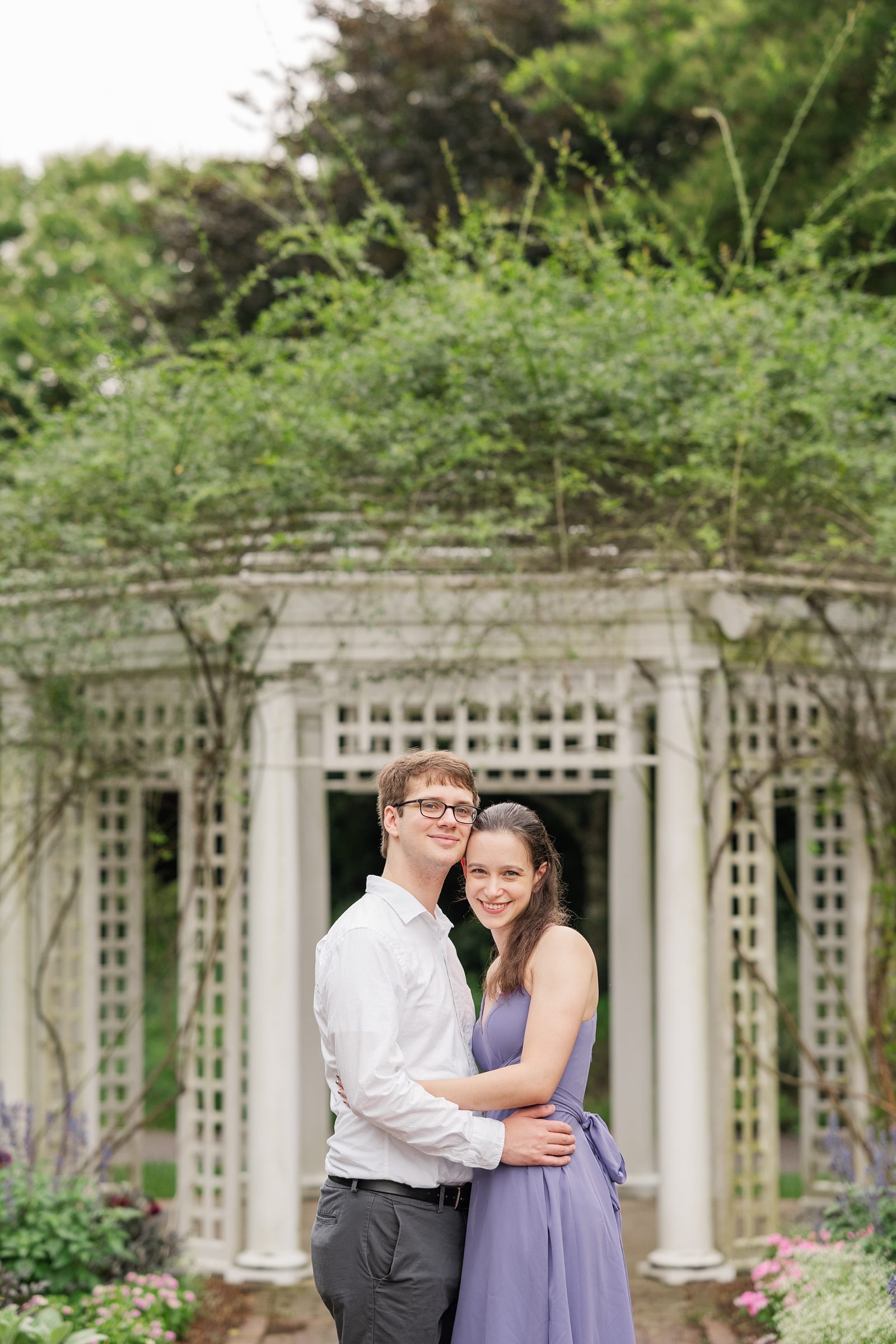 Summer Lewis Ginter Engagement Session in the gardens with purple dress. 